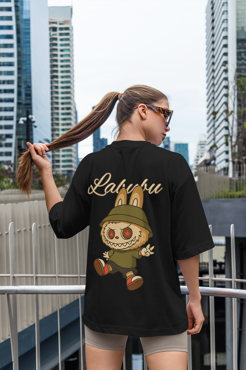 Woman wearing black oversized Labubu limited edition shirt with cartoon character on back in urban setting