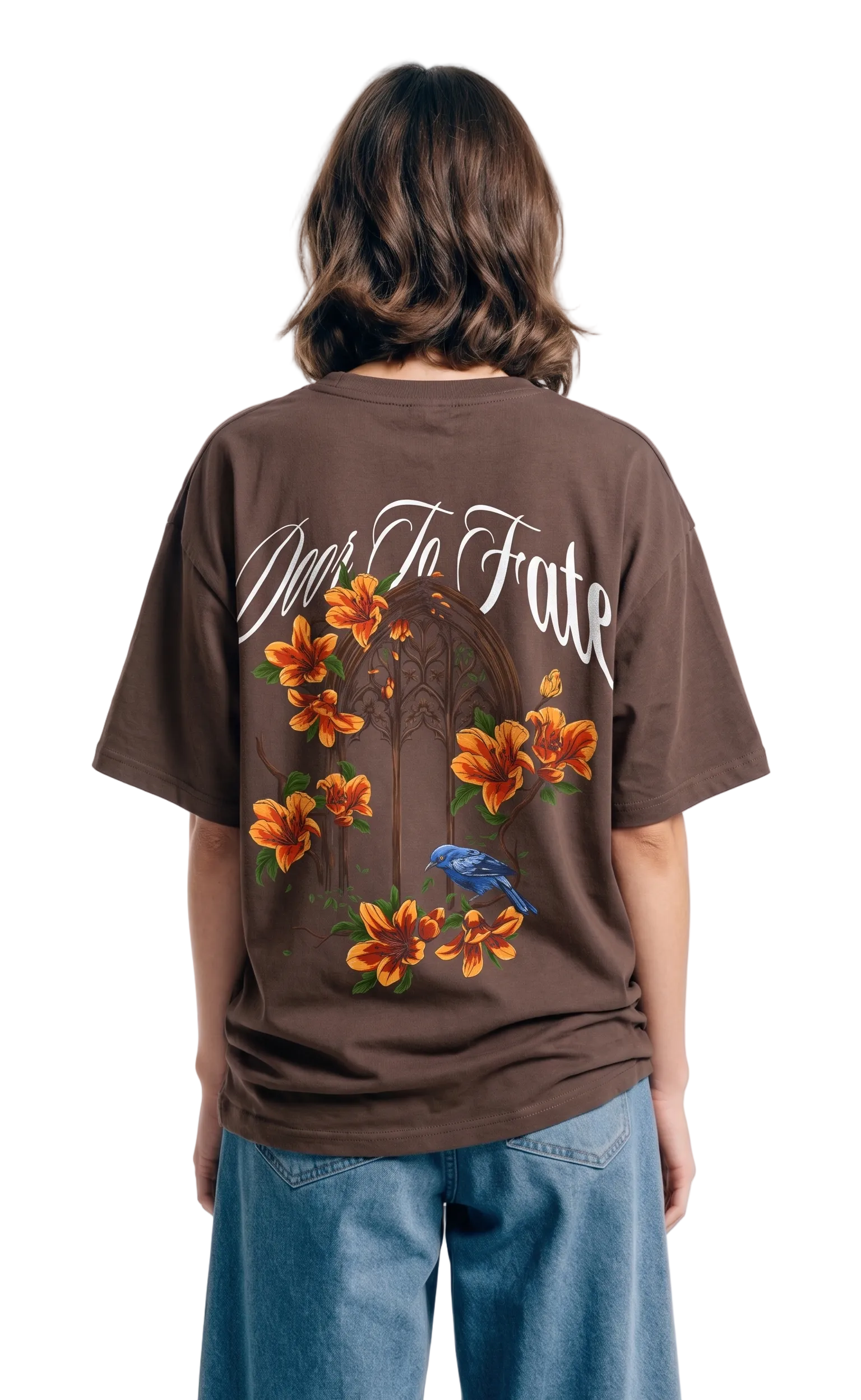Person wearing a brown t-shirt with floral designs and text on the back, standing against a white background.