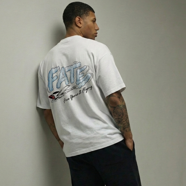 Man wearing a white t-shirt with text and graphics, standing against a plain background