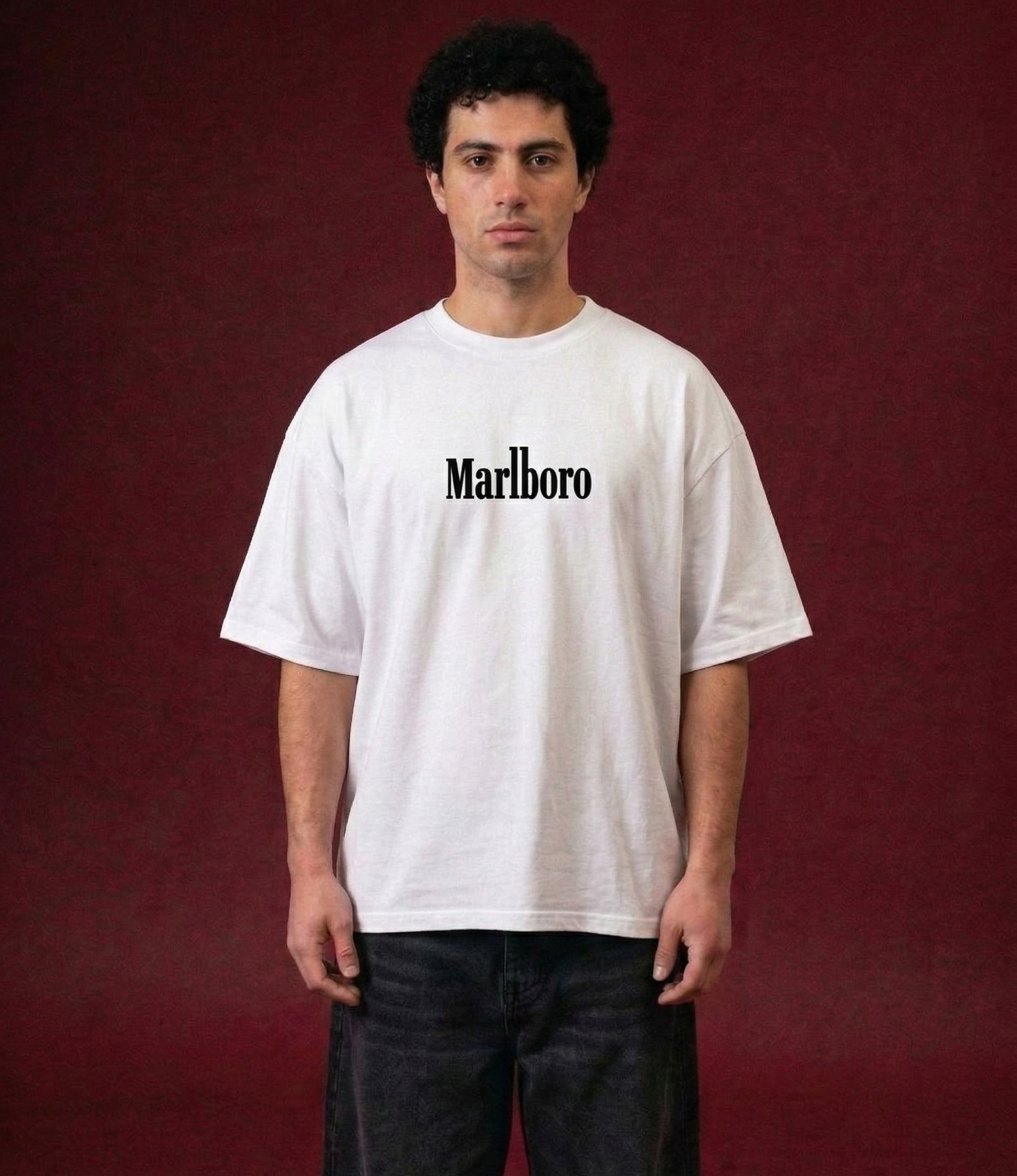 Person wearing a white t-shirt with 'Marlboro' logo on a red background