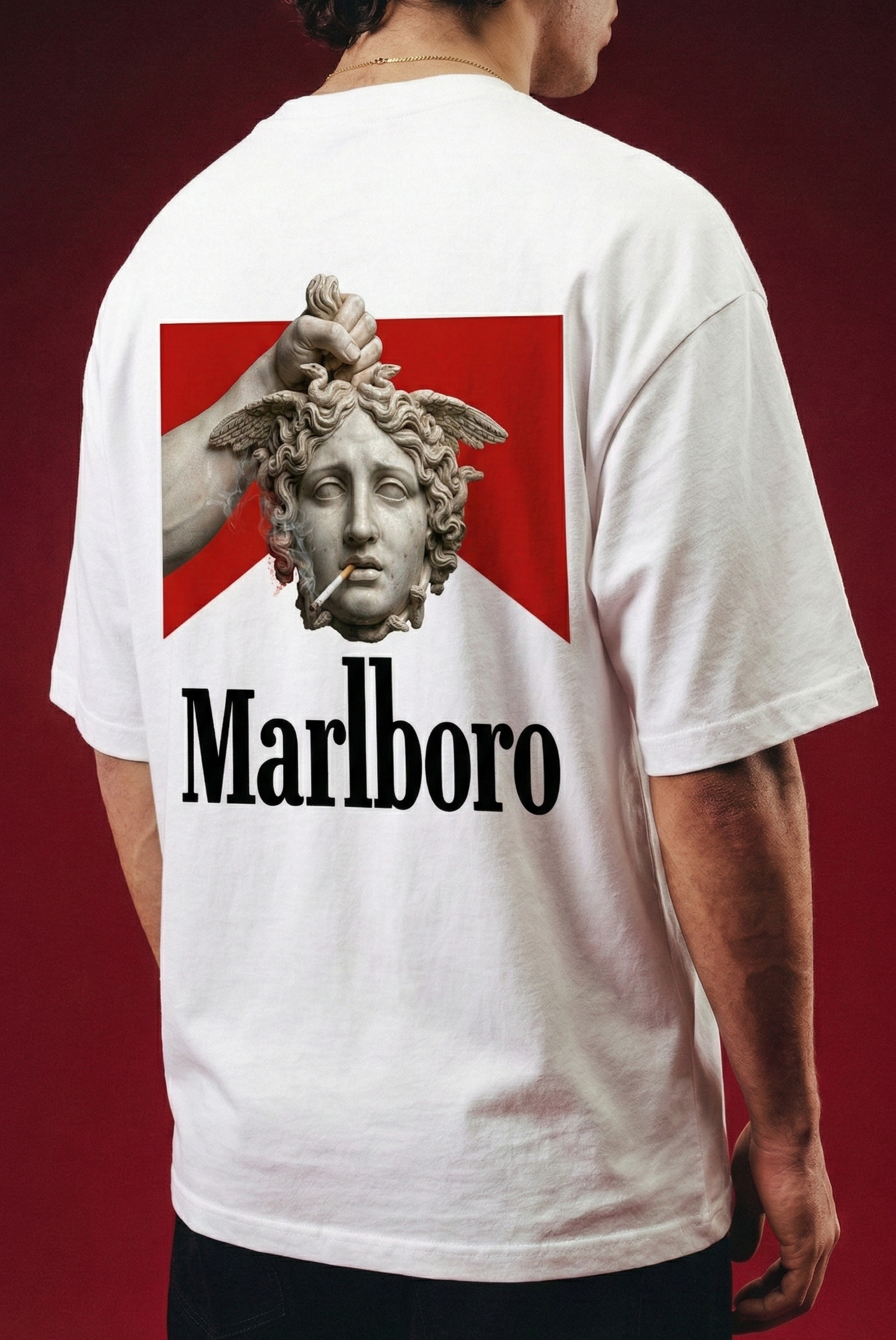 Person wearing a white t-shirt with a Marlboro logo on the back against a red background