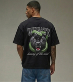Person wearing a black t-shirt with a panther graphic and text on the back, standing against a plain background.