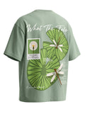 Green t-shirt with nature-themed design and text on a white background