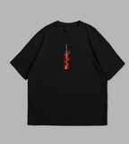 Black t-shirt with anime character design on a gray background
