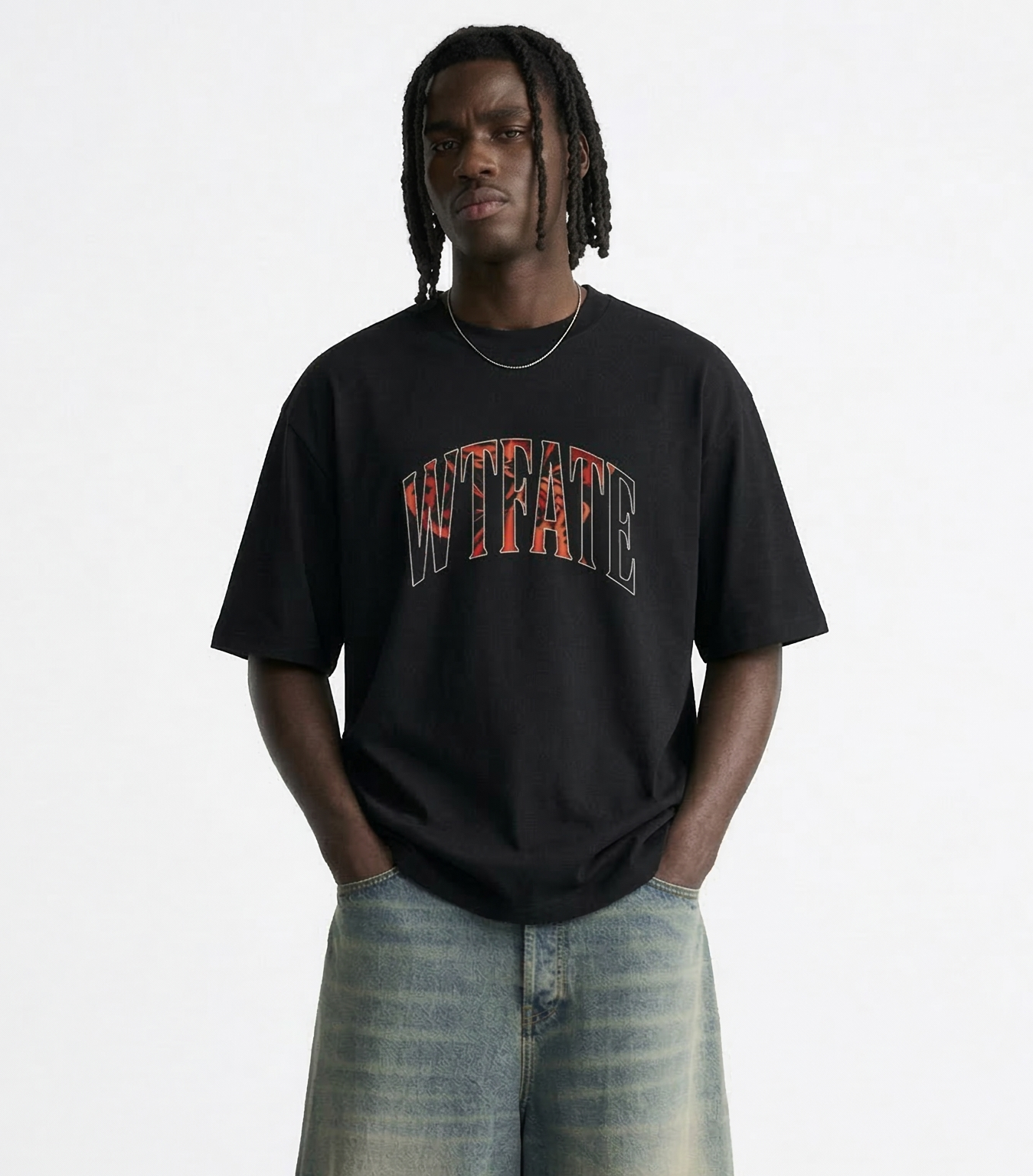 Person wearing a black t-shirt with colorful text and light blue jeans on a white background