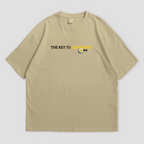 WHAT THE FATE Don't Waste Your Fate oversized t-shirt in black, with 'The Key to Happiness' text on the front and motivational message with flowers and butterflies on the back, 240 GSM terry cotton