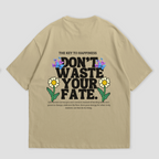 WHAT THE FATE Don't Waste Your Fate oversized t-shirt in black, with 'The Key to Happiness' text on the front and motivational message with flowers and butterflies on the back, 240 GSM terry cotton