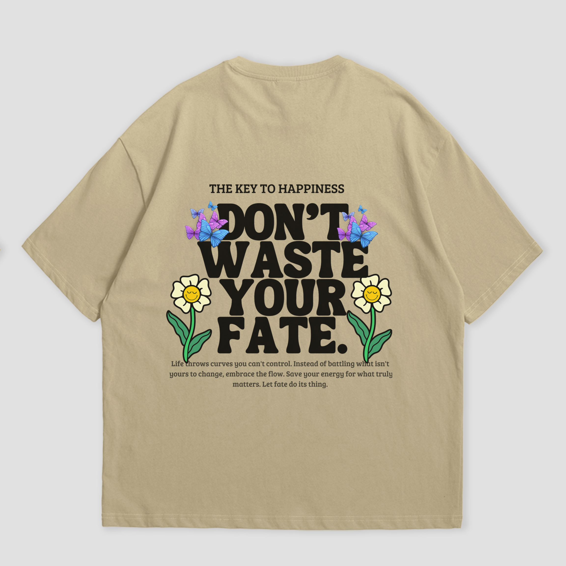 WHAT THE FATE Don't Waste Your Fate oversized t-shirt in black, with 'The Key to Happiness' text on the front and motivational message with flowers and butterflies on the back, 240 GSM terry cotton
