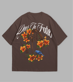 Brown t-shirt with floral and text design on a gray background