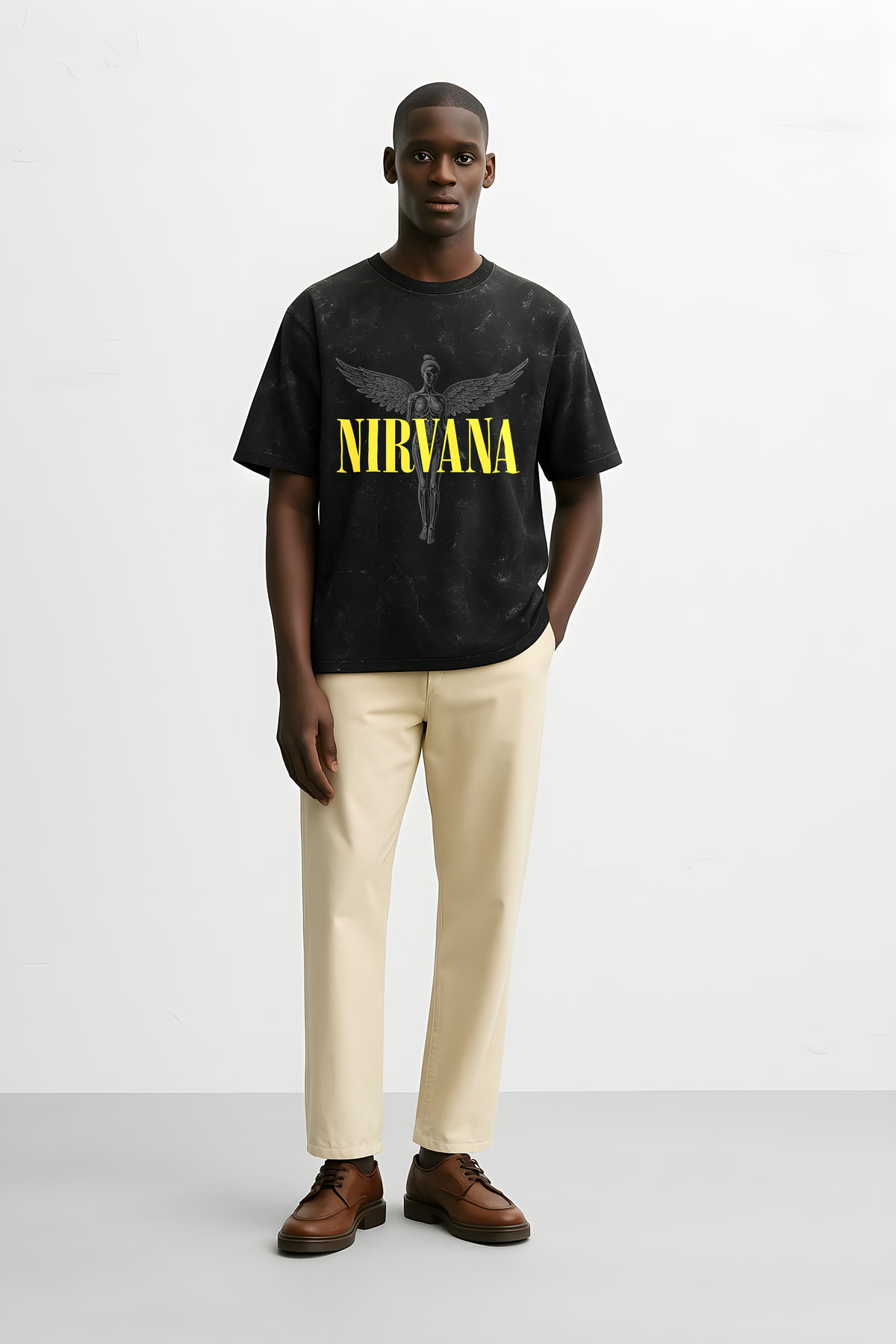 Nirvana Angel oversized tee in black featuring bold yellow lettering and a graphic design