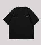 Black t-shirt with space-themed graphics on a gray background