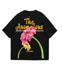 Oversized black t shirt with graphics featuring colorful flowers and inspirational text