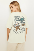 Travel to the Stars Oversized t-shirt featuring a playful astronaut graphic and directional sign