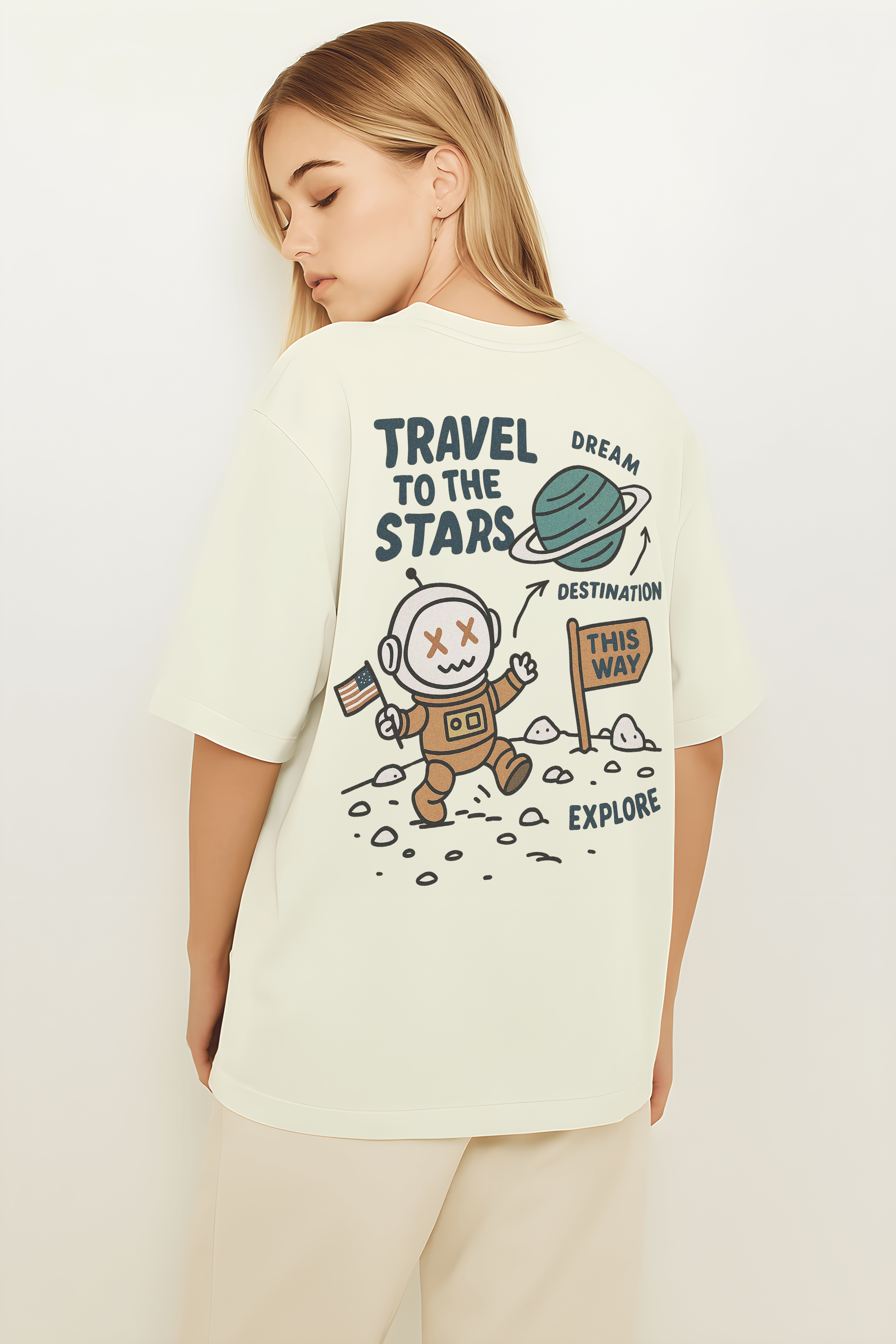 Travel to the Stars Oversized t-shirt featuring a playful astronaut graphic and directional sign