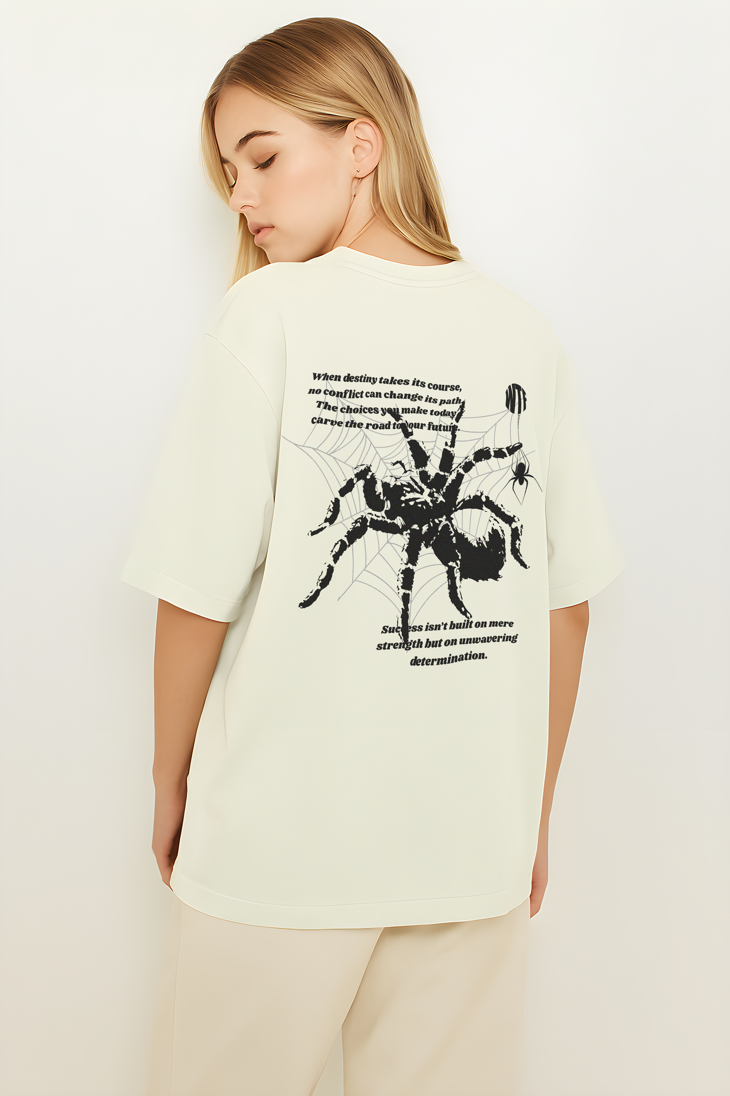 Oversize WHAT THE FATE spider web graphic t-shirt featuring a large spider design on the back