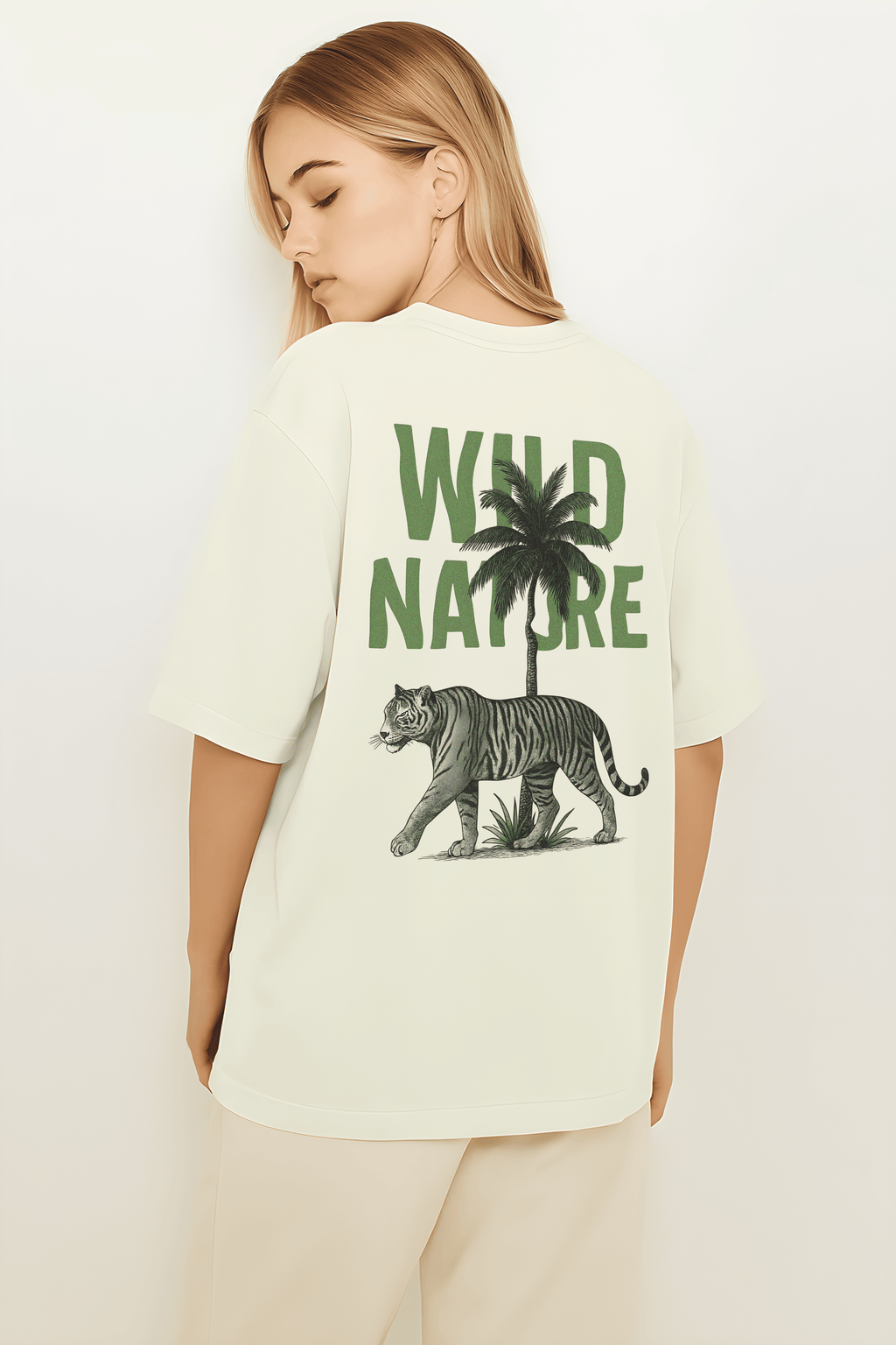 Wild Nature Oversized T-Shirt featuring a tiger and palm tree graphic on the back in a neutral color