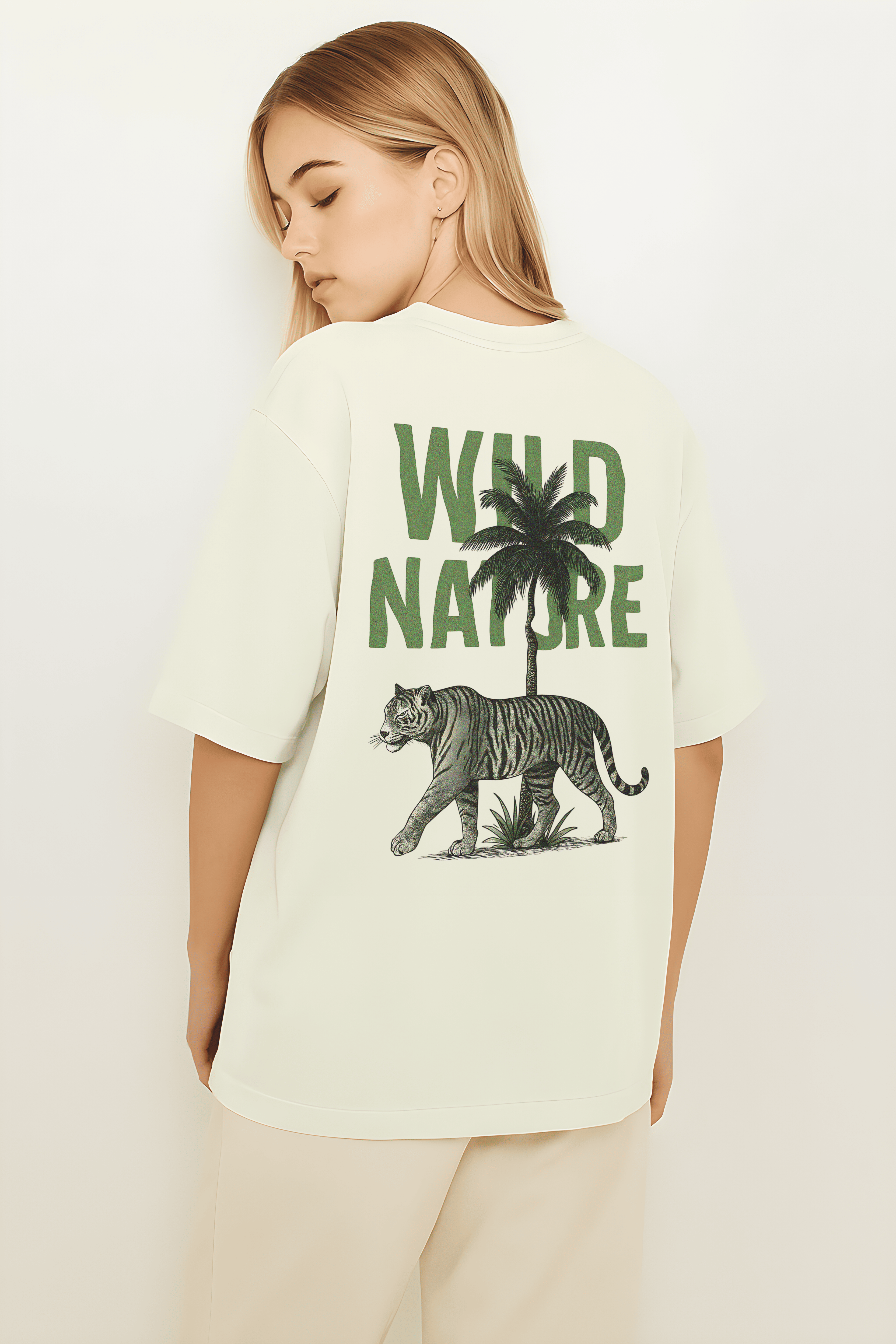 Wild Nature Oversized T-Shirt featuring a tiger and palm tree graphic on the back in a neutral color