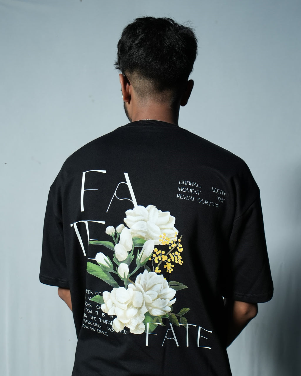 FATE Floral Graphic T-Shirt in oversized fit featuring bold floral design on the back.