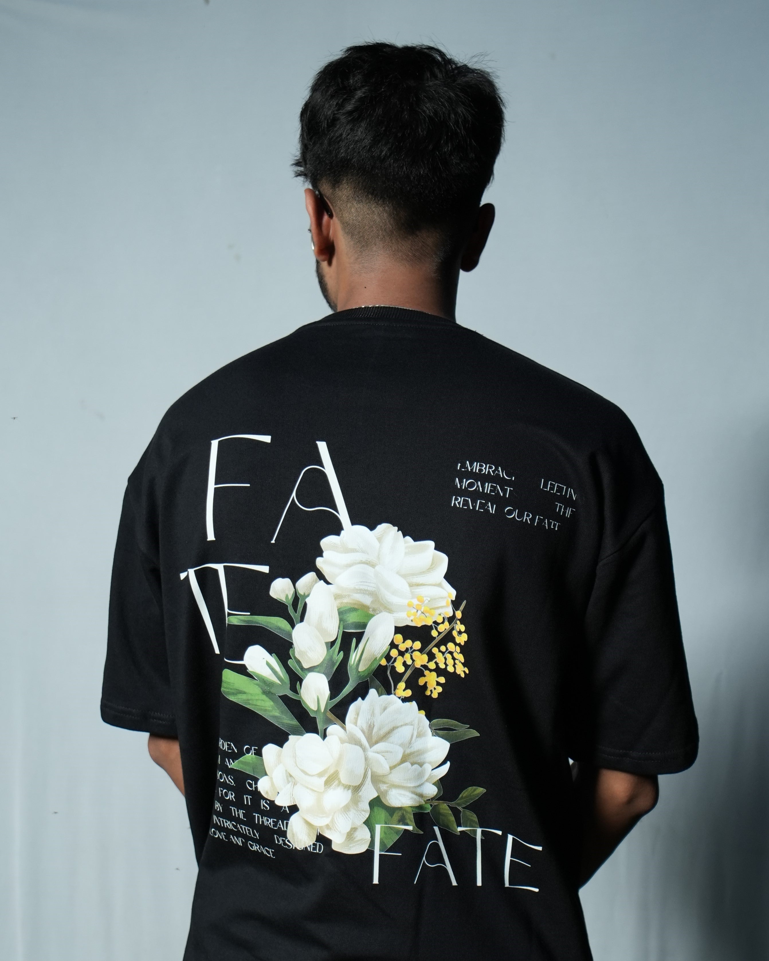 FATE Floral Graphic T-Shirt in oversized fit featuring bold floral design on the back.