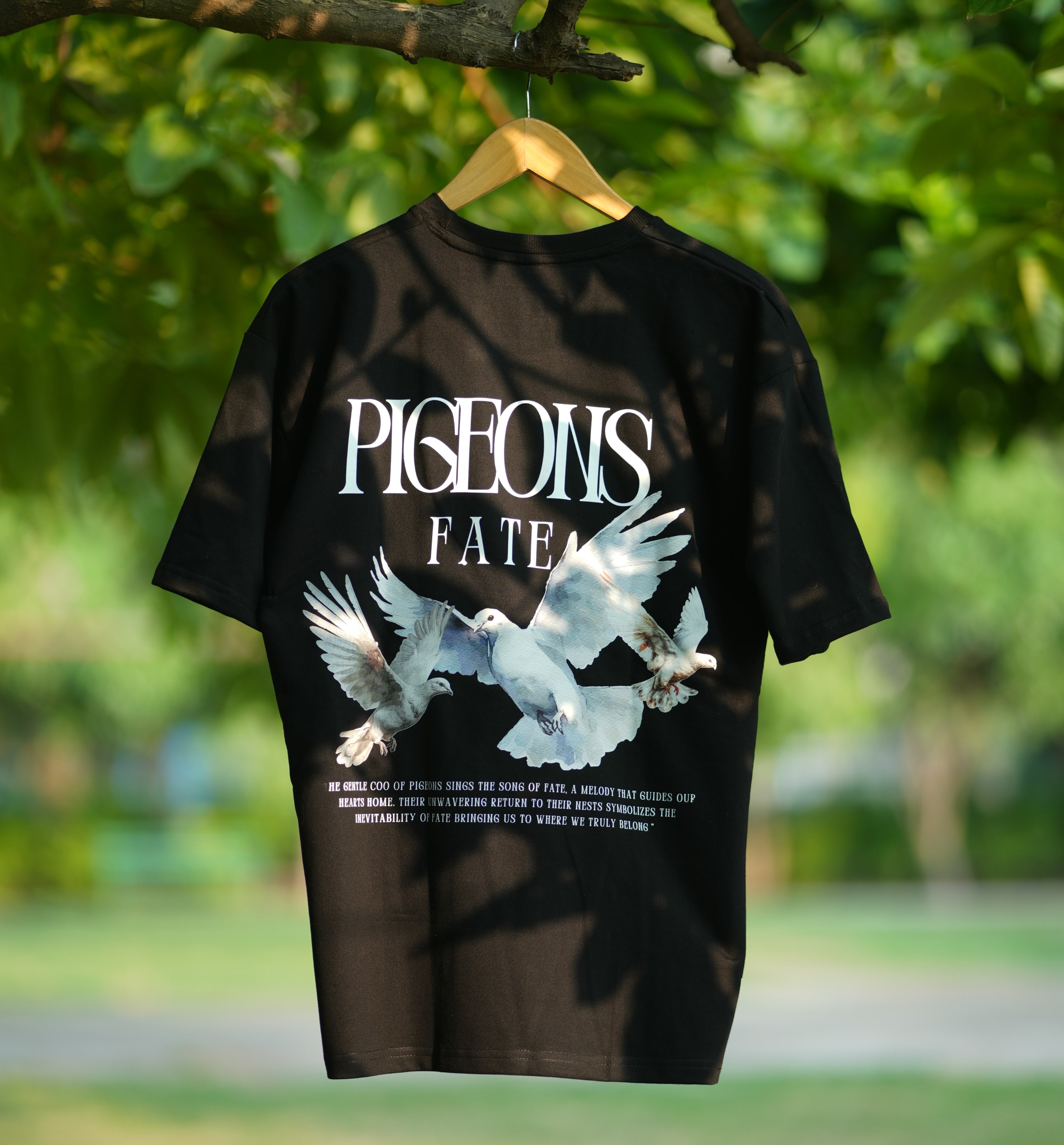 Pigeons of Fate cotton tee in black with bold graphic design featuring flying pigeons